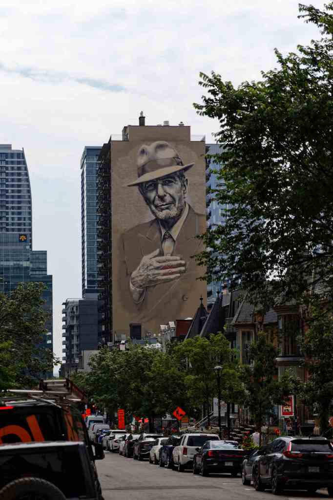 Mural, auf dem man Leonard Cohen sieht.